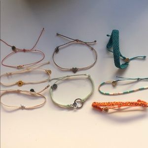 pura vida charm, beaded, and braided bracelets